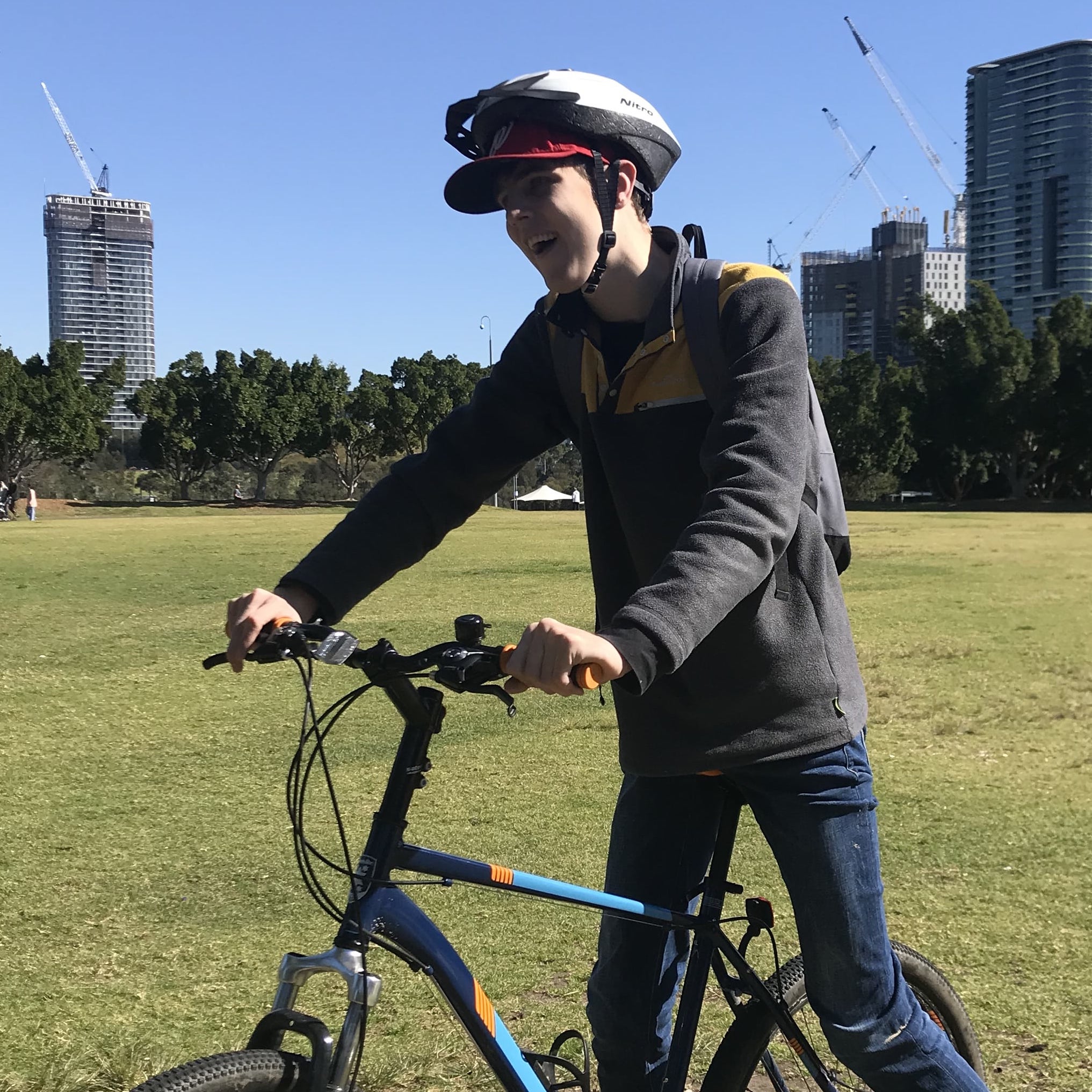 Ben is on a bike wearing a helmet in the park